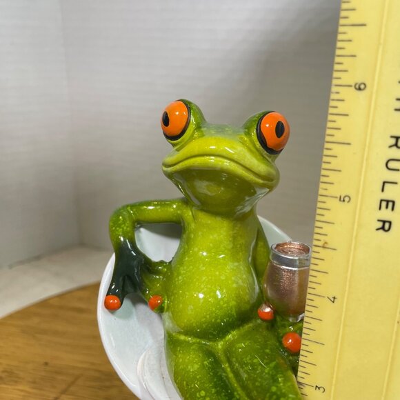 Green Ceramic Frog Figurine With Wine Glass Sitting In Modern White Chair - Picture 9 of 10